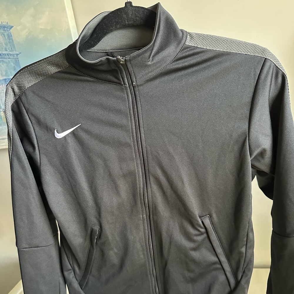 Kid’s Medium Black Nike jacket. Lightweight and full zip. Grey details